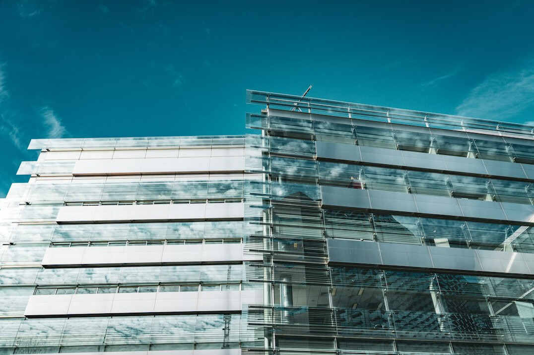 Modern glass office building exterior in daylight