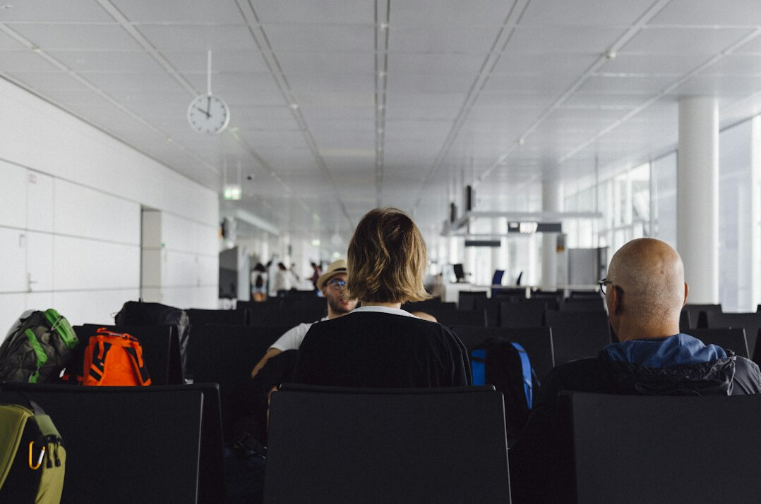 Corporate training classroom with people attending a programming workshop